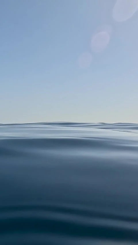 Small motorboat moving across the deep blue ocean. Scenic marine landscape with 库存影片 331555013