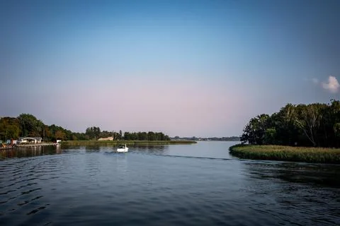 Small motorboat on the river. Stock Photos
