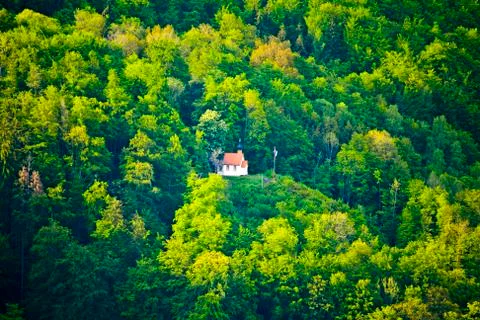 Small mountain chapel in the woods of Bavaria Stock Photos