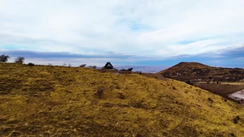 A small mountain house on the hilltop Stock Footage 293697859
