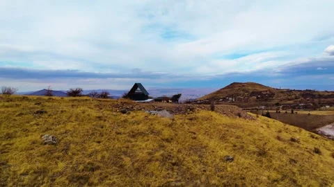 A small mountain house on the hilltop Stock Footage 293699739