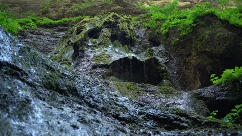 Small mountain river with crystal clear water. Water flows over the stones Stock Footage 162044247