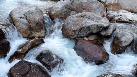 Small mountain river finding its way between the rocks Stock Footage 79441429
