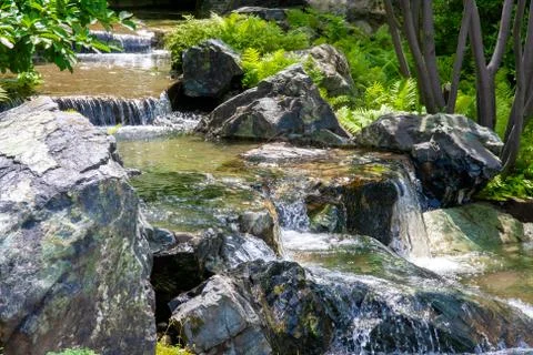 Small Mountain River Flowing Down Stock Photos