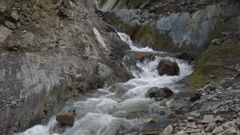 Small mountain river flowing through rocky gorge in the Caucasus Mountains, Dage Stock Footage 325819618