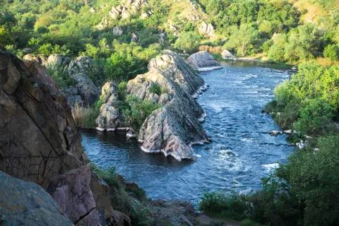 Small mountain river. Landscape with stream flowing between rocks. Water in Stock Photos