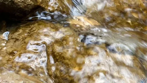 Small mountain river with a small waterfall 库存影片 106029572