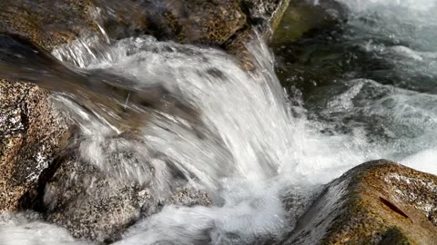 Small mountain stream cascade over river rock Video stock 311127274