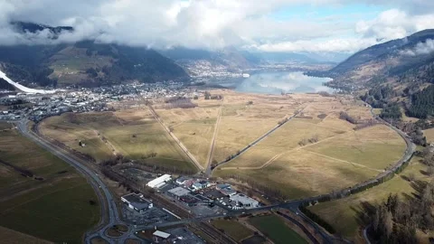 A small mountain town located on a lake Stock Footage 274667832