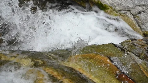 Small mountain twin waterfall flume with gentle falls over sedimentary rock Video stock 234733115