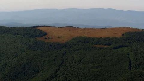 A small mountain valley where the grass is very dry Stock Footage 69083838