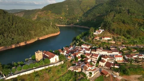 Small mountain village located on a peninsula on the shore of a river Stock Footage 201731602