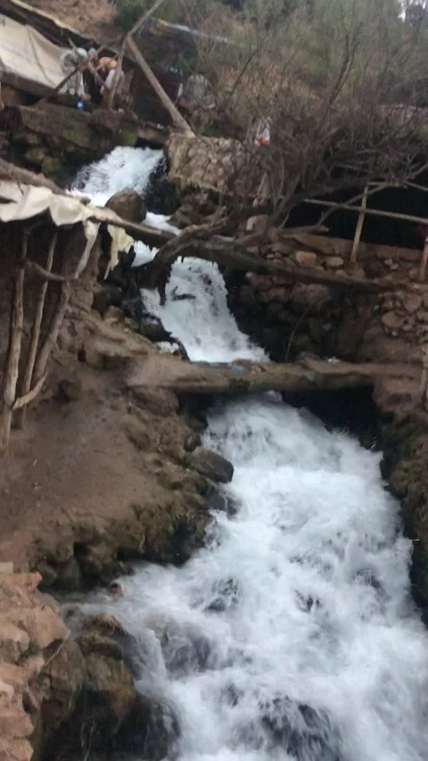 Small Mountain Waterfall Flowing Through Rustic Village Stream Stock Footage 330603279