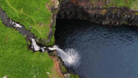 Small mountain waterfall from a height Stock Photos