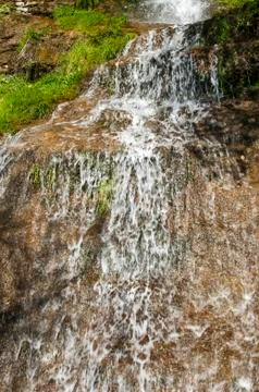 Small mountain waterfall Stock Photos