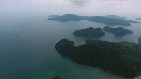 Small mountains surrounded by an ocean Stock Footage 111698969