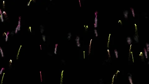 Small multi-colored firecrackers fly up and down, leaving a trail of sparks and Stock Footage 156311587