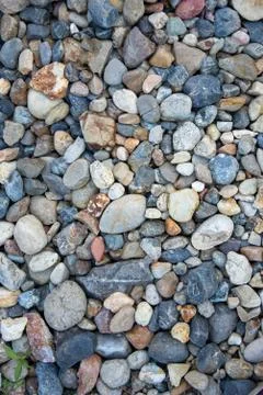 Small multi-colored pebbles texture background. colorful stones. vertical pho Stock Photos