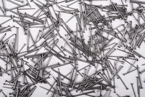 Small nails top view on white background Stock Photos
