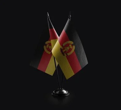 Small national flags of the DDR on a black background Stock Illustration