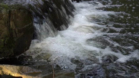Small natural waterfall with bubbling flowing water 스톡 동영상 320600002