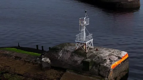 Small Navigation Safety Beacon on Ayr Harbour wall, Aerial view Stock Footage 342294494
