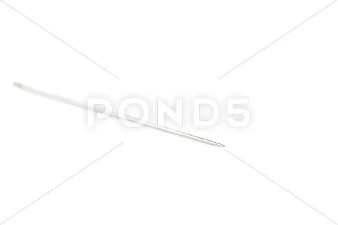 Small needle isolated over the white background Stock Photos