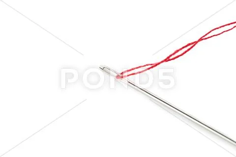 Small needle with thread isolated over the white background Stock Photos