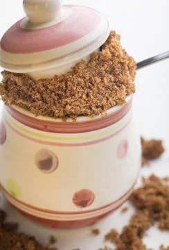 Small nice pot filled with brown sugar Stock Photos