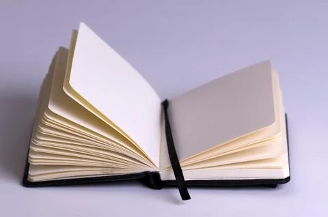Small notebook open on a blank page Stock Photos
