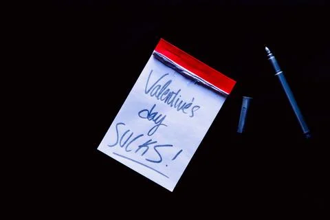 Small notebook with a red border on a black background Stock Photos