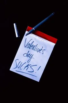 Small notebook with a red border on a black background Stock Photos