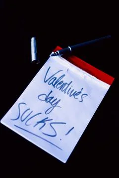 Small notebook with a red border on a black background Stock Photos