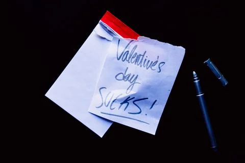 Small notebook with a red border on a black background Stock Photos