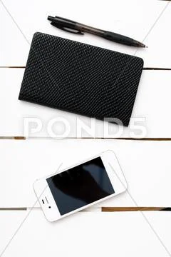 Small notepad with pen and smartphone Stock Photos