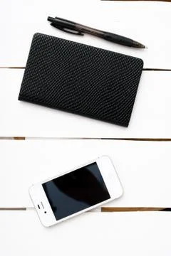 Small notepad with pen and smartphone Stock Photos