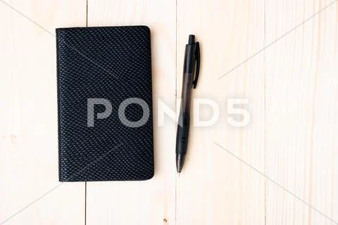 Small notepad with pen Stock Photos