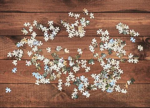 A small number of puzzles on the table for the game. Stock Photos