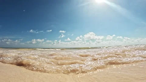 Small ocean waves come to shore on a beautiful seaside beach resort in Cancun, M Stock Footage 262345849