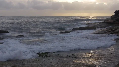 Small Ocean Waves Crashing with Boat Under Sun Rays Stock Footage 72436788