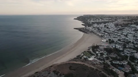 Small ocean waves gently unfolding on sand beach, Praia da Luz, Algarve. Stock Footage 154580388