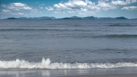 Small ocean waves - mountains, horizon and cloudy sky - maritime background Stock Footage 143483361
