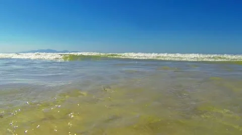 Small ocean waves running into camera Stock Footage 22226845