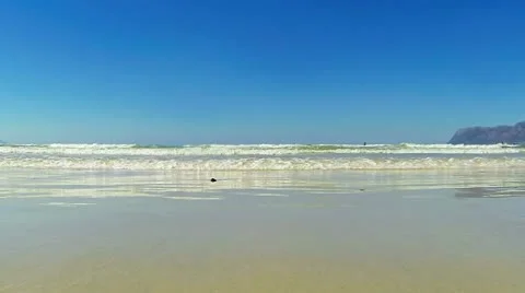 Small ocean waves running into camera Stock Footage 22226916