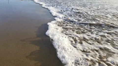 Small ocean waves by the sand Stock Footage 100490763