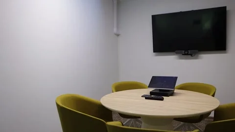 Small office conference table pan around inside Stock Footage 342337244