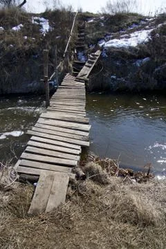 Small, old bridge over the stream. Stock-Fotos