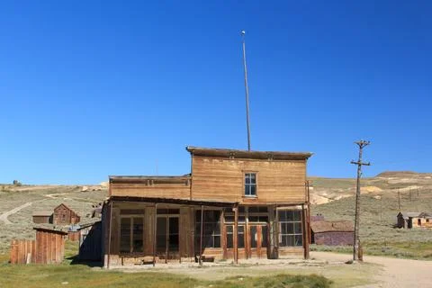 A small, old building with a pole on top of it Fotos de archivo