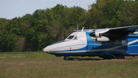 Small Old Propeller Plane Preparing for Takeoff Standing on runway in Field Stock Footage 155464615