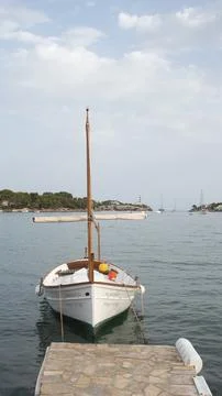 Small old ship moored in the harbor Stock Photos